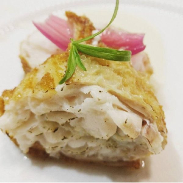 Ballotine with haddock and langoustine stuffing wrapped in chicken skin