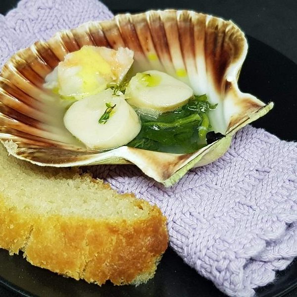 Baked scallop in its own shell