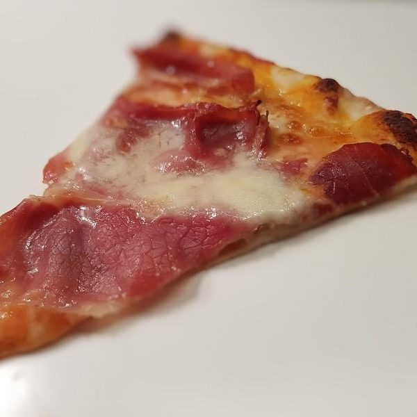 Pizza with ham and truffle pesto