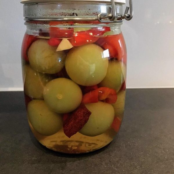 Pickled green tomatoes with chili and ginger