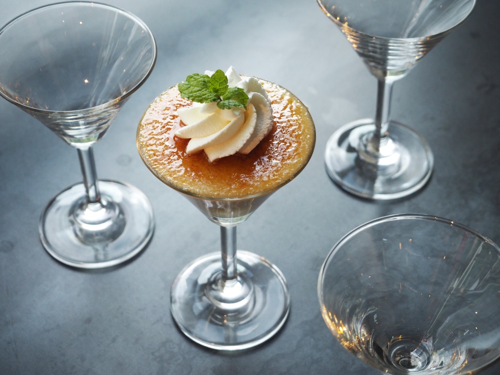 Delicious,Creme,Brulee,Served,In,Martini,Cocktail,Glass,On,Dark