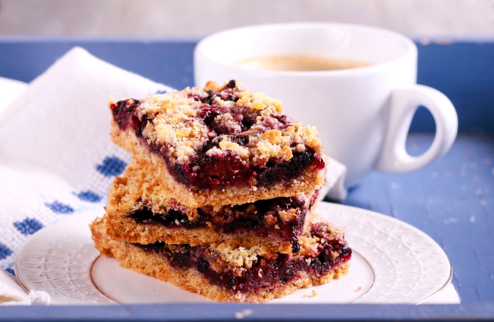 Blueberry,Bars,With,Crumble,Topping,And,Cup,Of,Coffee,Blackberry