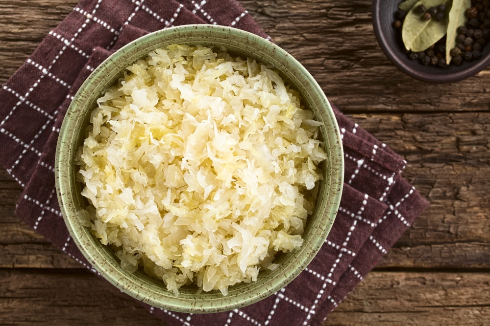 Fresh,Healthy,Sauerkraut,In,Bowl,With,Black,Pepper,And,Bay