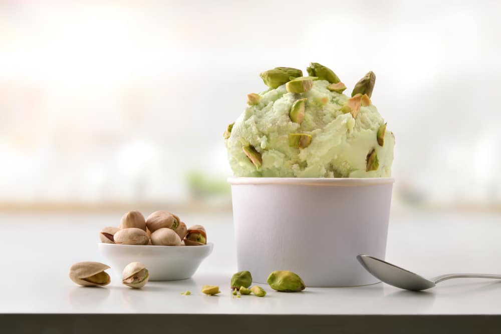 Pistachio,Ice,Cream,Cup,On,White,Table,Homemade,With,Kitchen