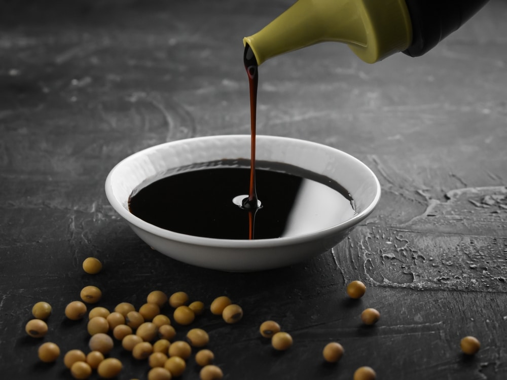 Pouring,Sweet,Soy,Sauce,Into,White,Ceramic,Bowl,From,Bottle