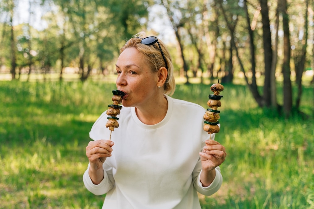 Mature,Woman,50,Years,Old,Eating,Grilled,Bbq,Vegetables,From