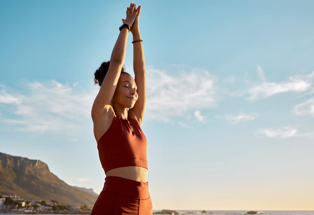 Black,Woman,,Yoga,Pray,Hands,And,Meditation,Wellness,On,Beach.
