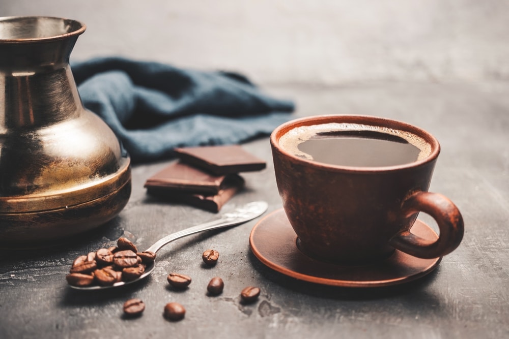 Black,Coffee,Drink,In,A,Clay,Cup,,Turkish,Jezve,Coffee