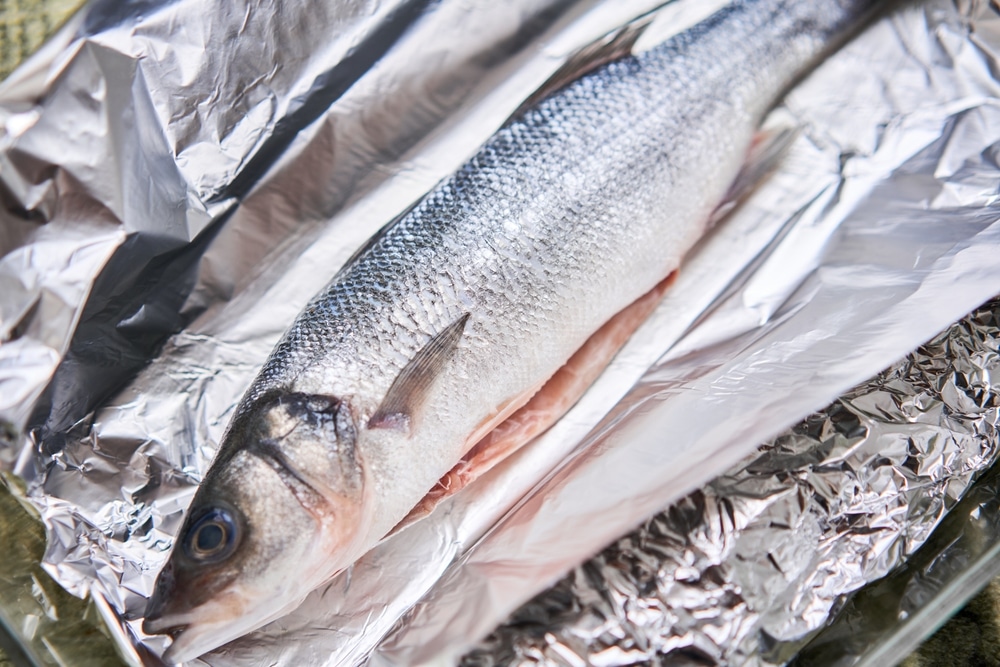 Salmon,Whole,Fish,On,Foil,Ready,For,Baking,In,The