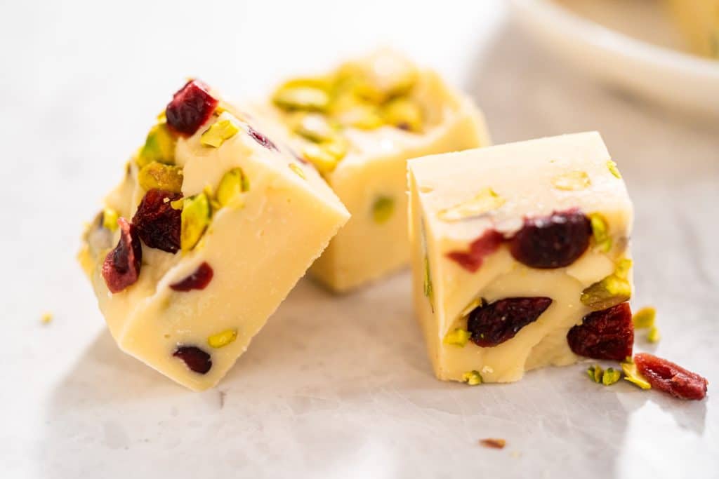 Homemade,Cranberry,Pistachio,Fudge,Square,Pieces,On,A,Kitchen,Counter.