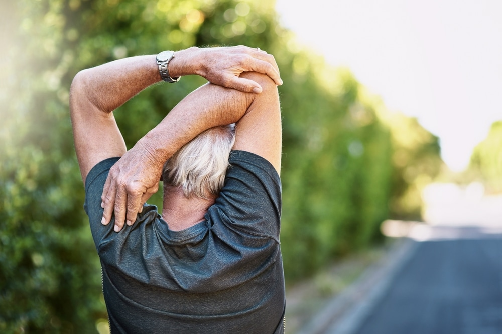 Fitness,,Senior,And,Man,Stretching,Arm,In,Street,For,Morning