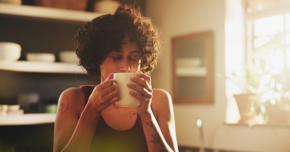 Woman,,Home,And,Kitchen,With,Cup,Of,Coffee,On,Morning