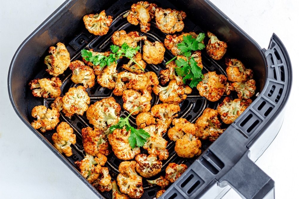 Air,Fryer,Roasted,Cauliflower,Garnished,With,Cilantro,Top,Down,Photo