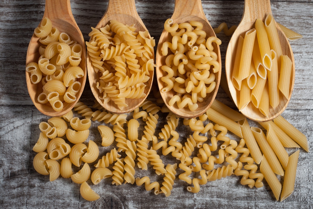 Various,Mix,Of,Pasta,On,Wooden,Rustic,Background,,Sack,And