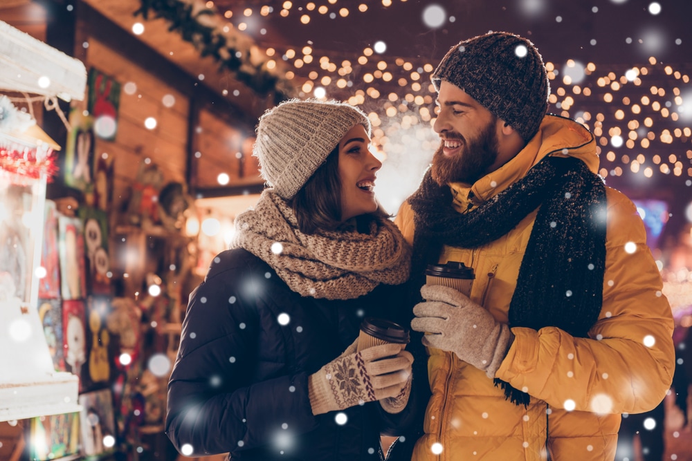Having,Fun,Together,At,A,Christmas,Fairy,With,Snowfall.,Young