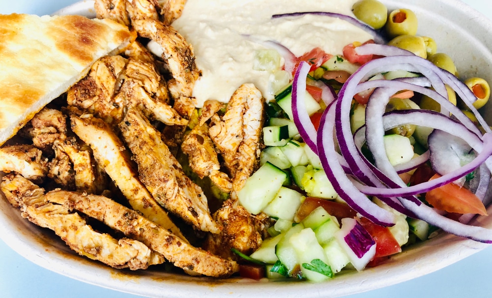 Mediterranean,Chicken,Shawarma,Rice,Bowl,With,Hummus,Greek,Salad,Olives