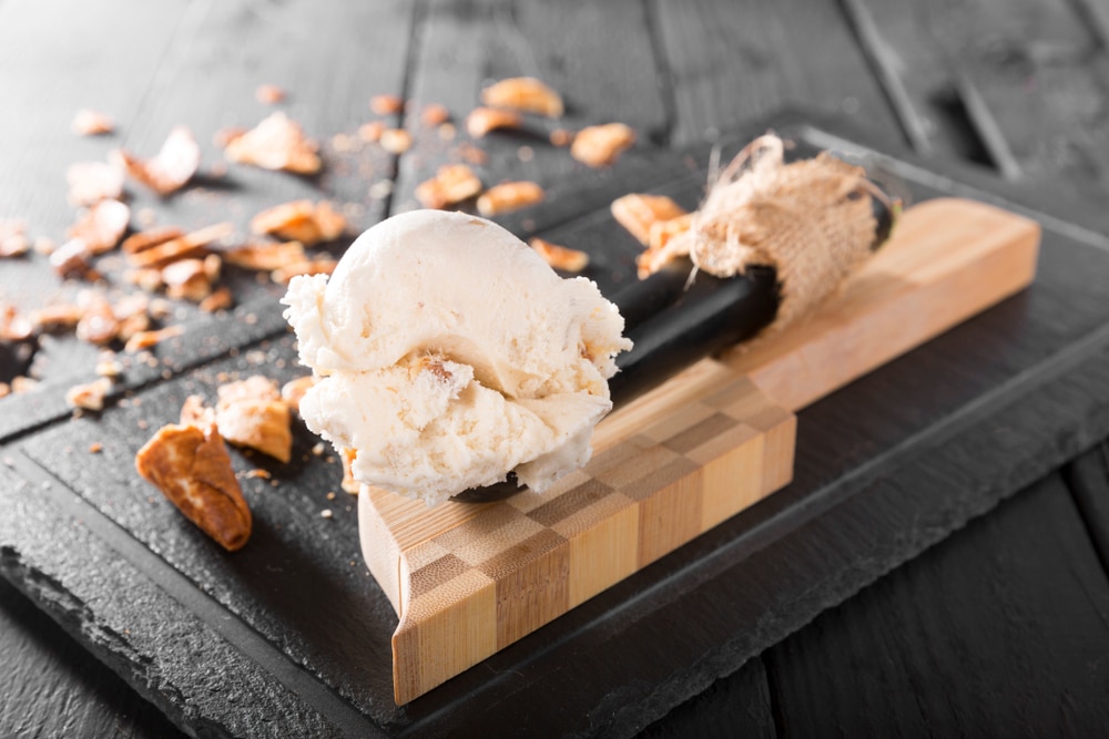 Walnut,Ice,Cream,Scoop,On,Vintage,Wooden,Table,Background,With