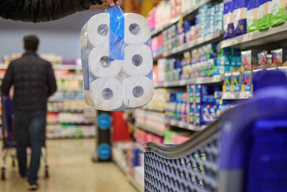 At,The,Supermarket,Buying,A,Toilet,Paper,Package,,And,Putting
