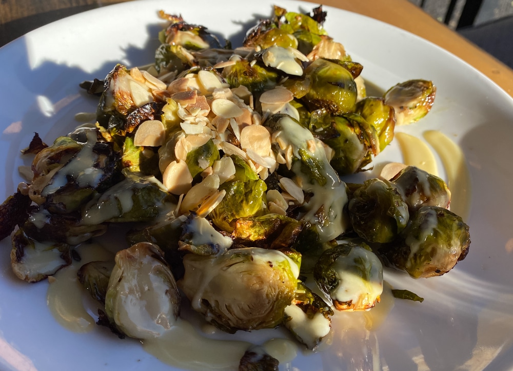 Close,Up,View,Of,Charred,Brussels,Sprouts,With,Almond,On