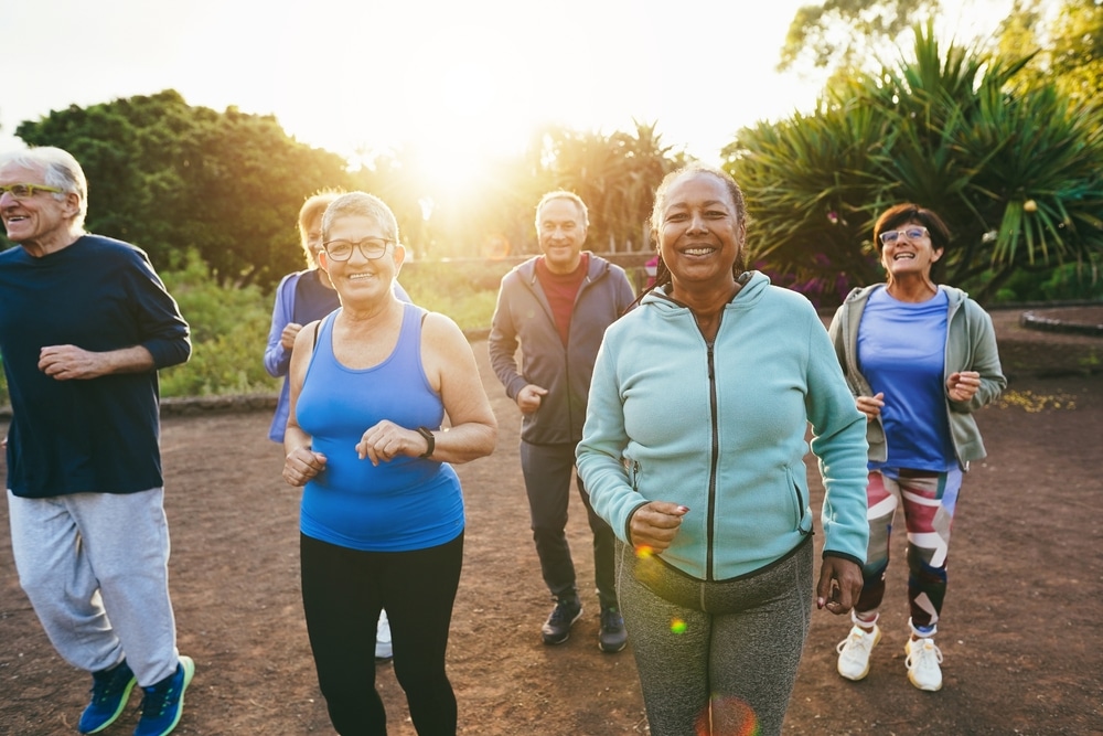Fit,Senior,People,Running,At,City,Park,-,Group,Of