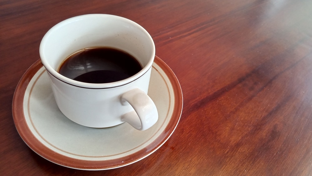 Still,Life,Photography,Of,A,Cup,Of,Coffee,On,Brown