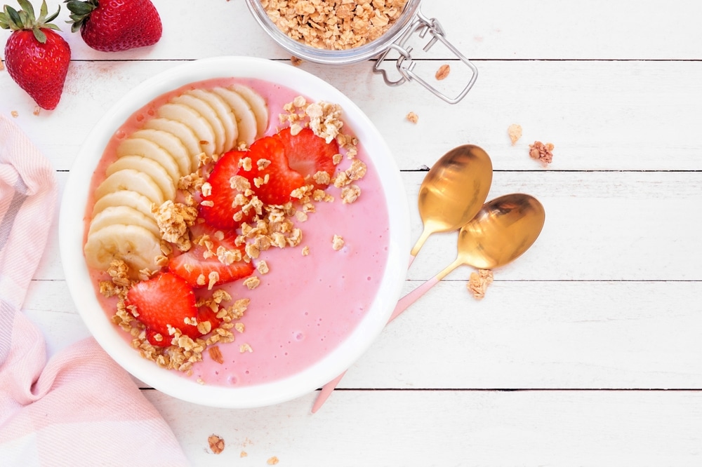 Healthy,Strawberry,And,Banana,Smoothie,Bowl,With,Granola.,Top,Down