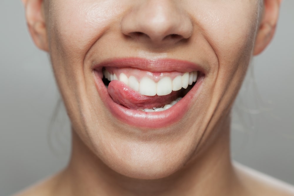 A,Close-up,Image,Capturing,A,Happy,Woman,Licking,Her,Lips,