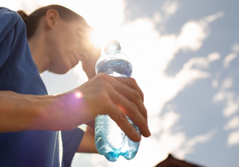 Woman,Drinking,Water,Cooling,Off,In,Extreme,Summer,Heat,Wave,