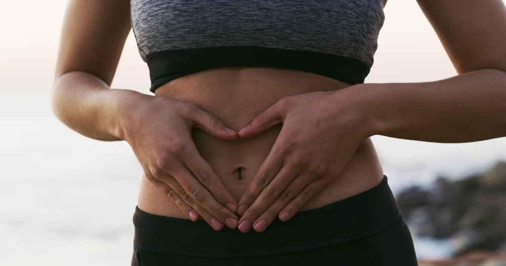 Woman,,Hands,And,Fitness,With,Stomach,For,Gut,Health,,Balance