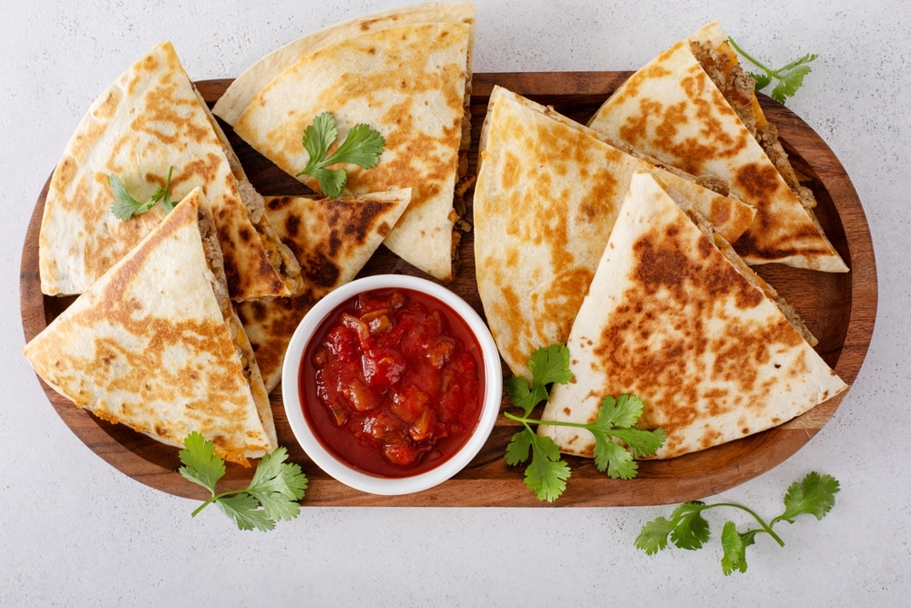 Ground,Turkey,And,Cheddar,Quesadillas,Served,With,Sour,Cream,And