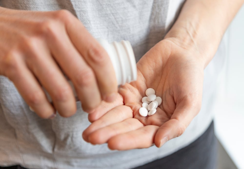 Young,Woman,With,Several,Pills,In,Her,Hands