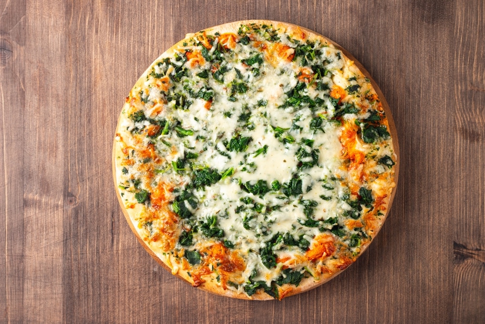 Vegetarian,Pizza,With,Spinach,,Arugula,,Pesto,,Cheese,And,Parmesan.,Italian