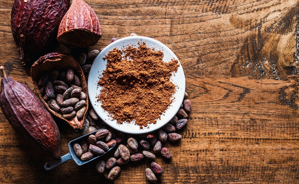 Top,View,Of,Natural,Cocoa,Powder,With,Brown,Cocoa,Beans