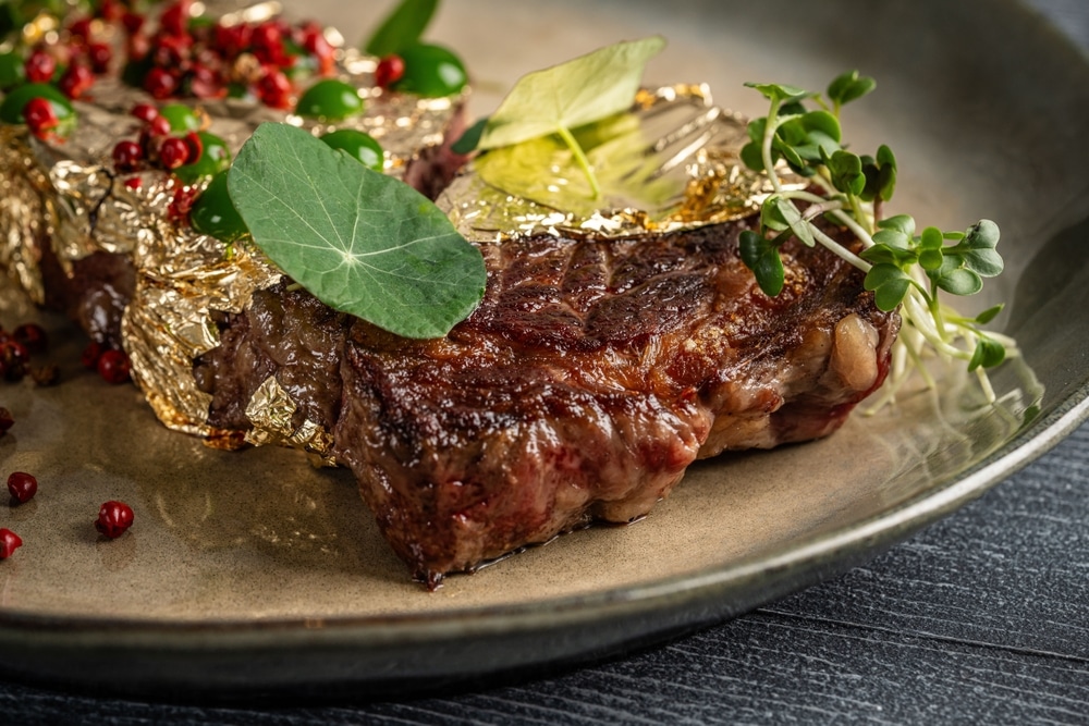 Premium,Grilled,Beef,Steak,Decorated,With,Edible,Gold,Leaf,,Microgreens,