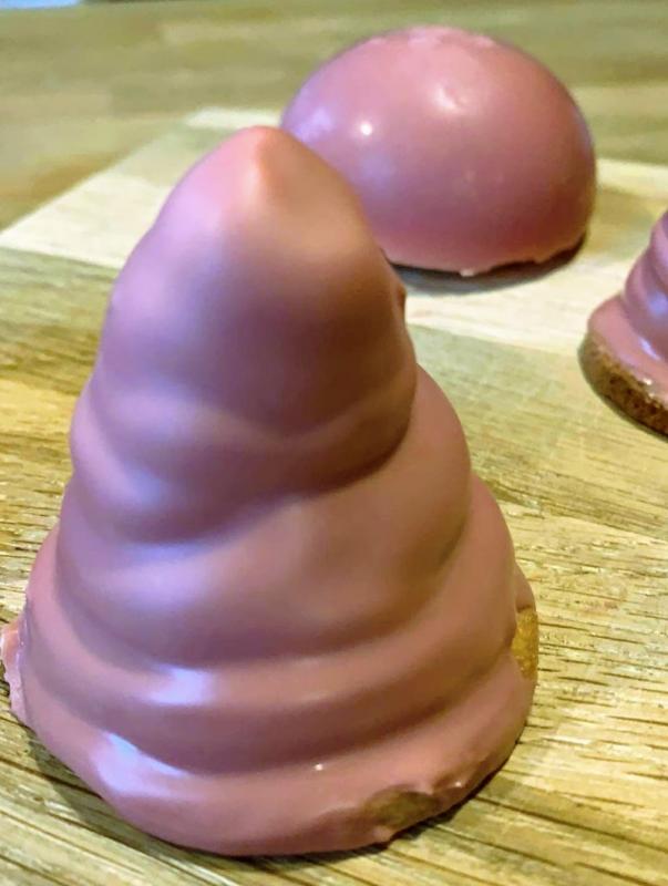Homemade chocolate-coated marshmallow puffs with ruby chocolate