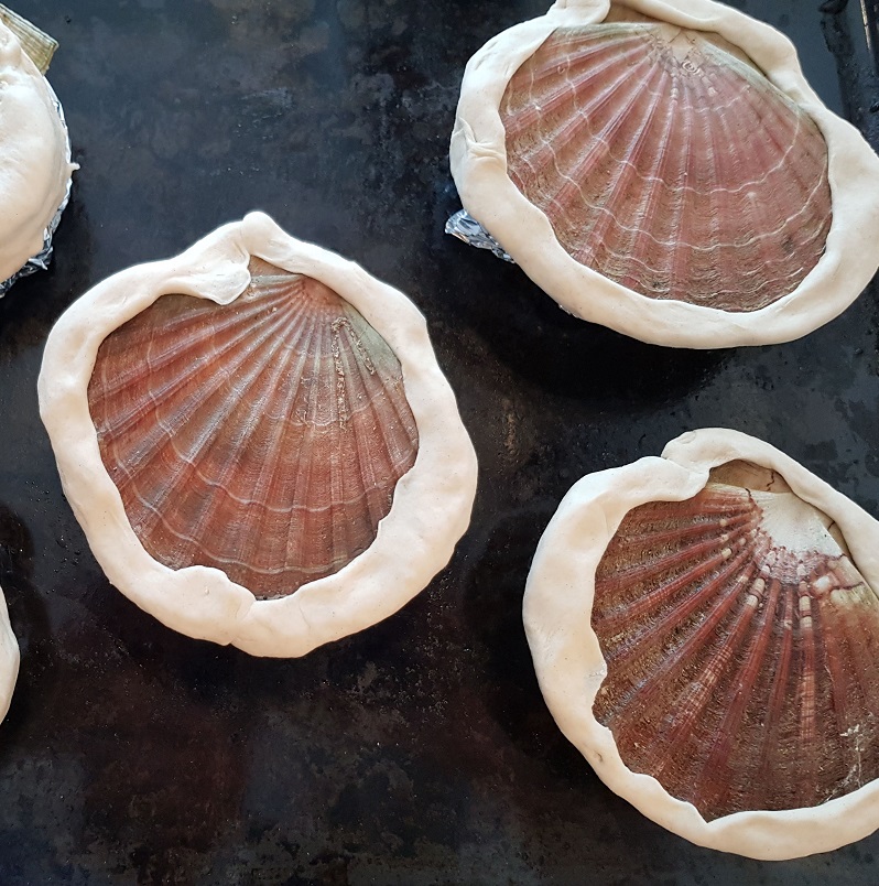 Baked scallop in its own shell