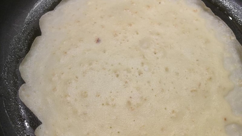 The pancake is ready to be flipped