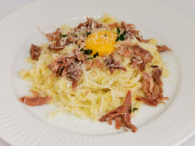 Pasta with confit duck and egg yolk
