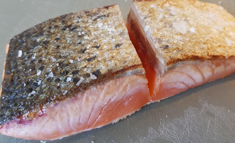 Fried salmon on pan